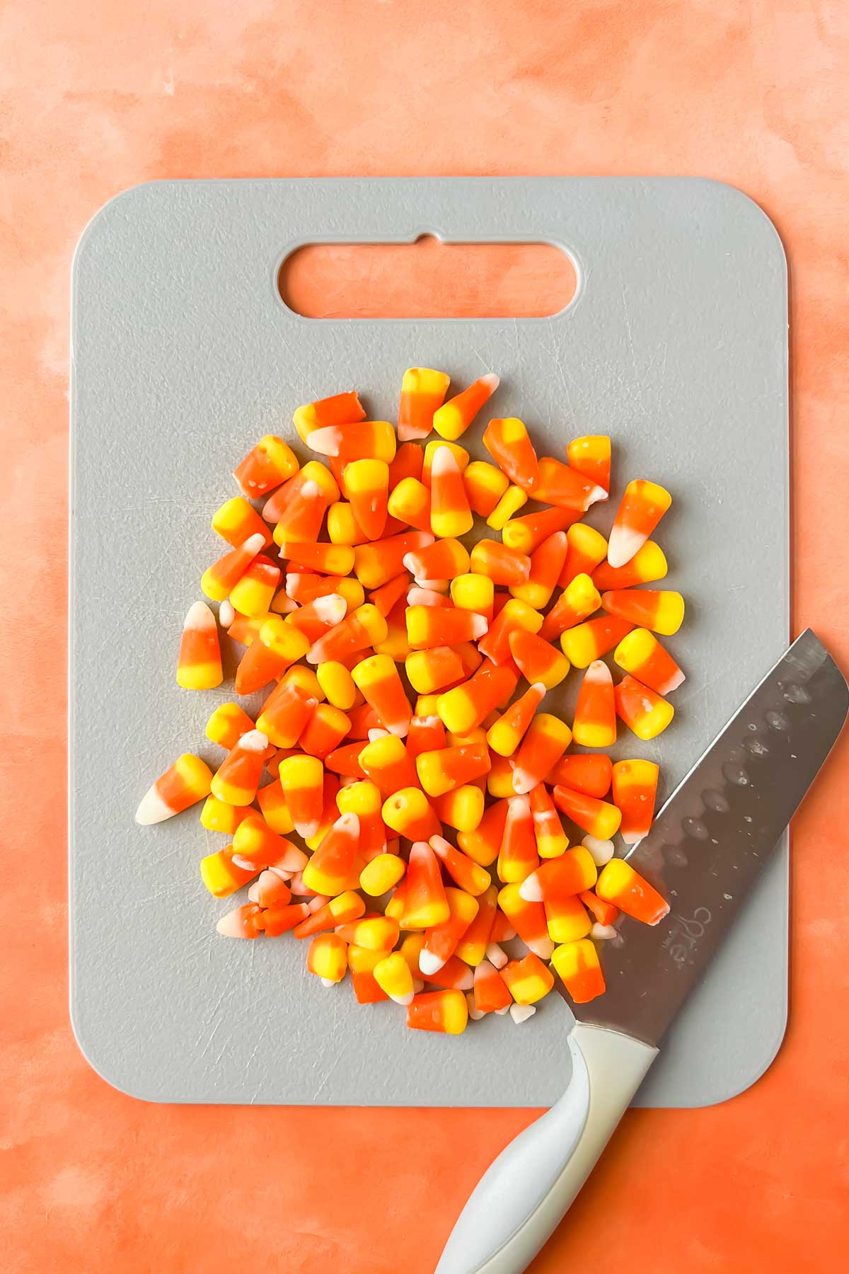 candy corn on gray cutting board.