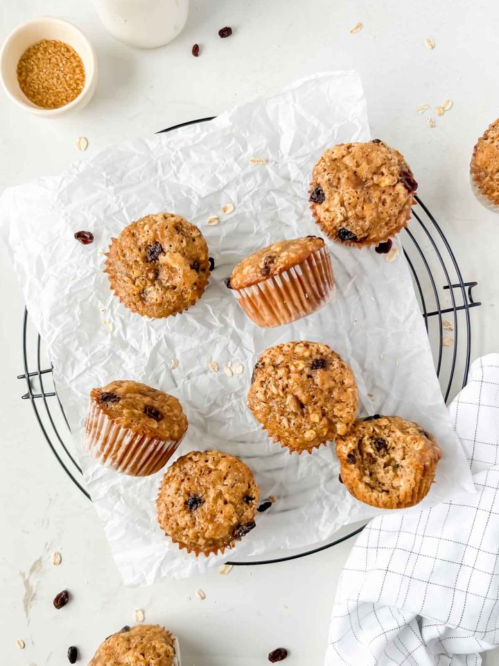 baked oatmeal raisin muffins on parchment.