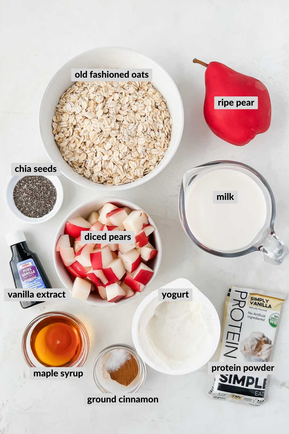 ingredients needed for overnight oats in individual bowls on white background.