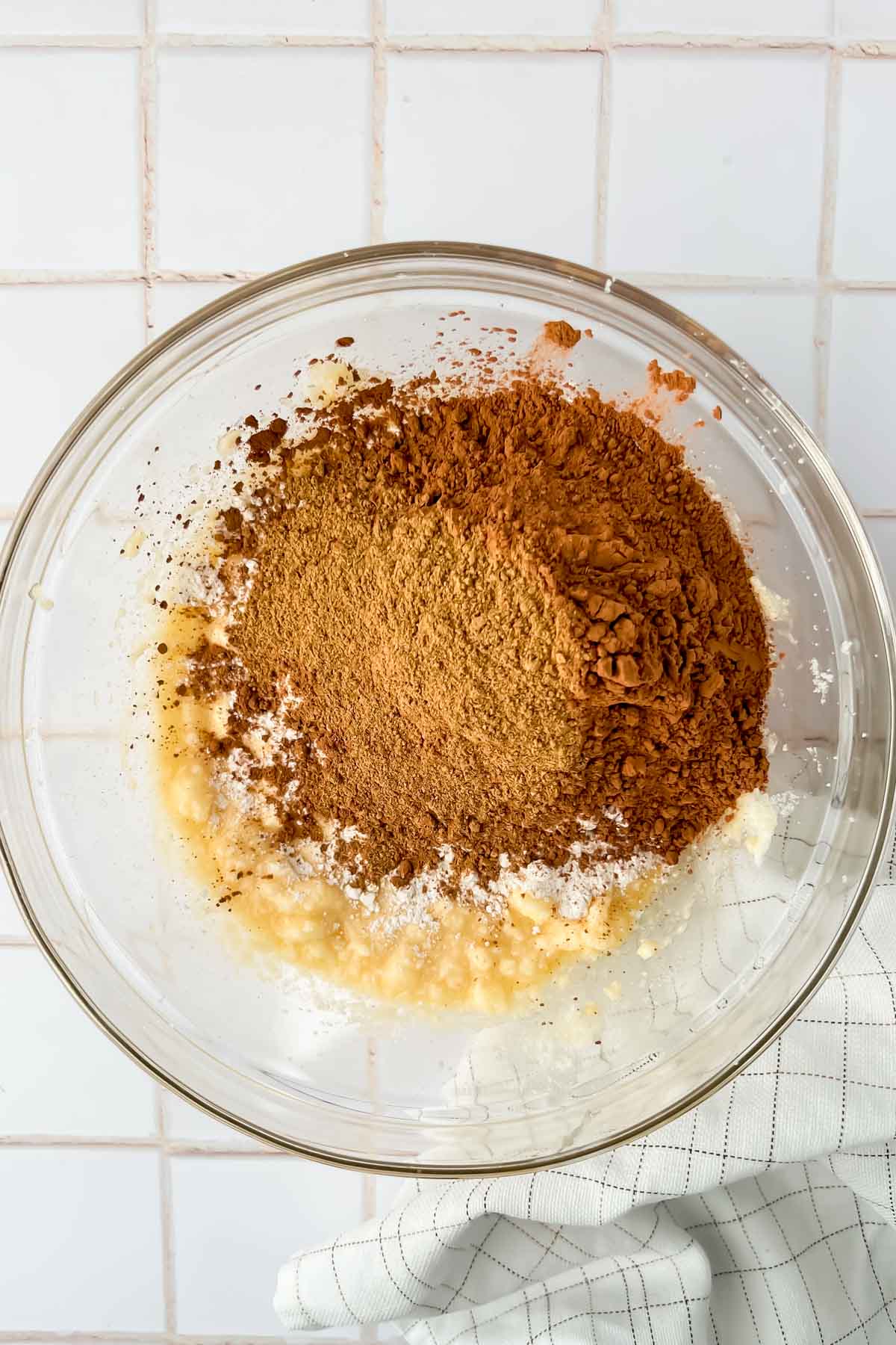 cocoa powder and remaining dry ingredients added to creamed butter in glass mixing bowl.