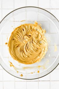 butter and cashew butter whipped together in glass mixing bowl.