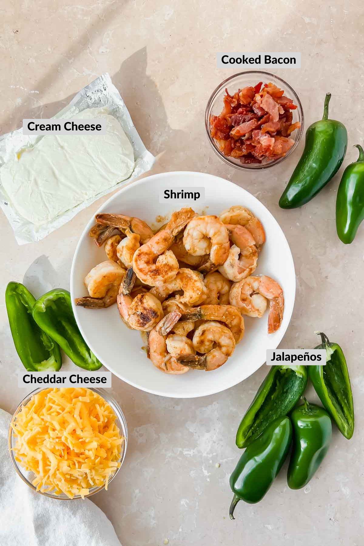 ingredients for jalapeño shrimp poppers in individual bowls.