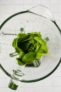 fresh spinach and cold filtered water added to blender.