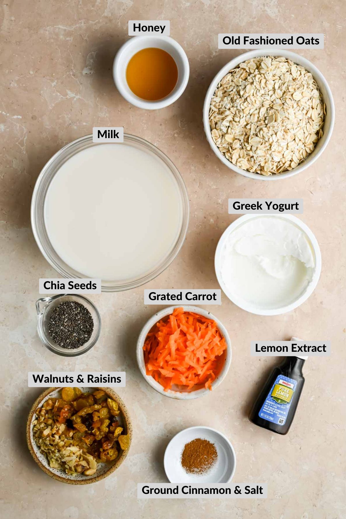 labeled ingredients for carrot cake overnight oats in individual bowls.
