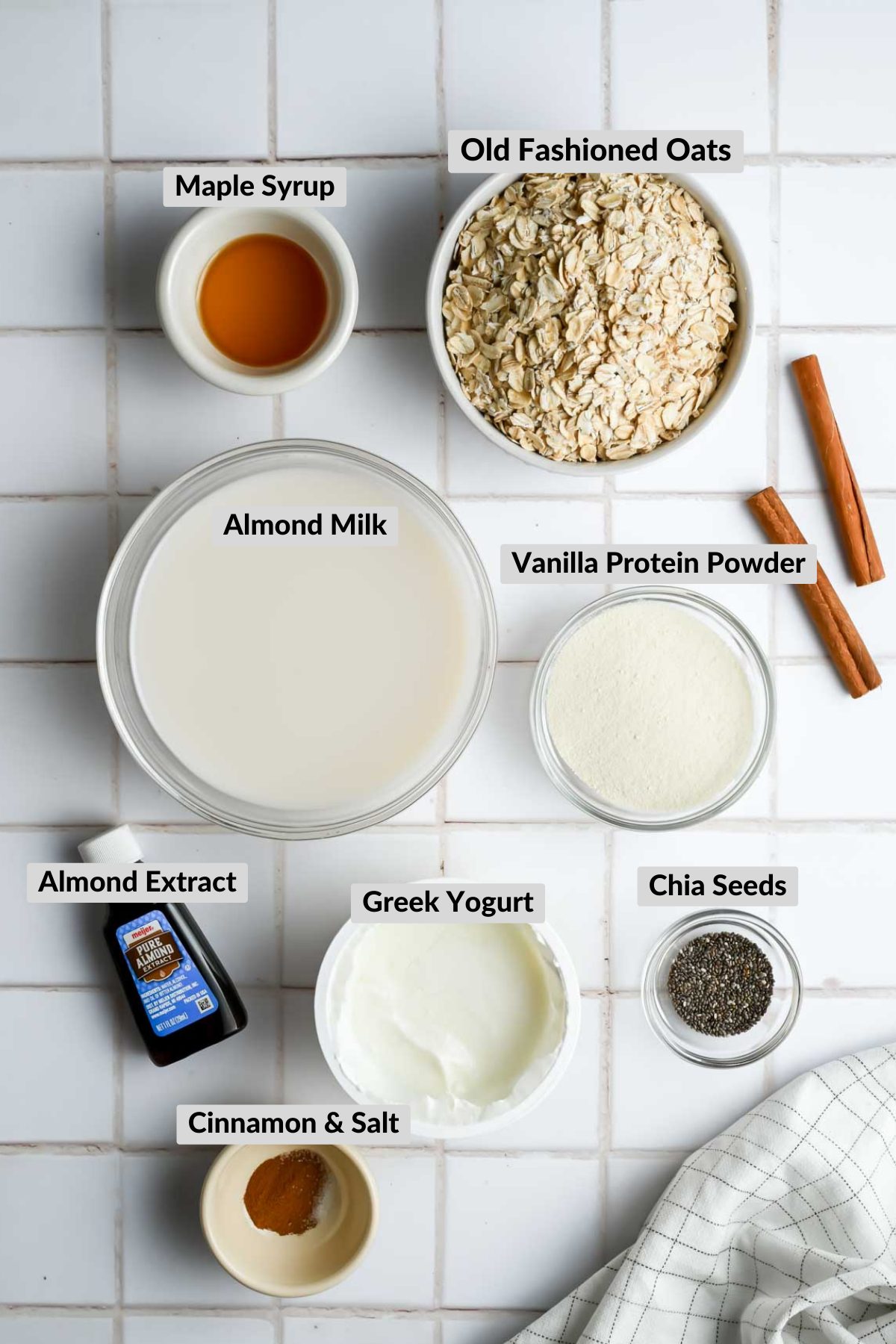 labeled ingredients for cinnamon roll overnight oats in individual bowls.