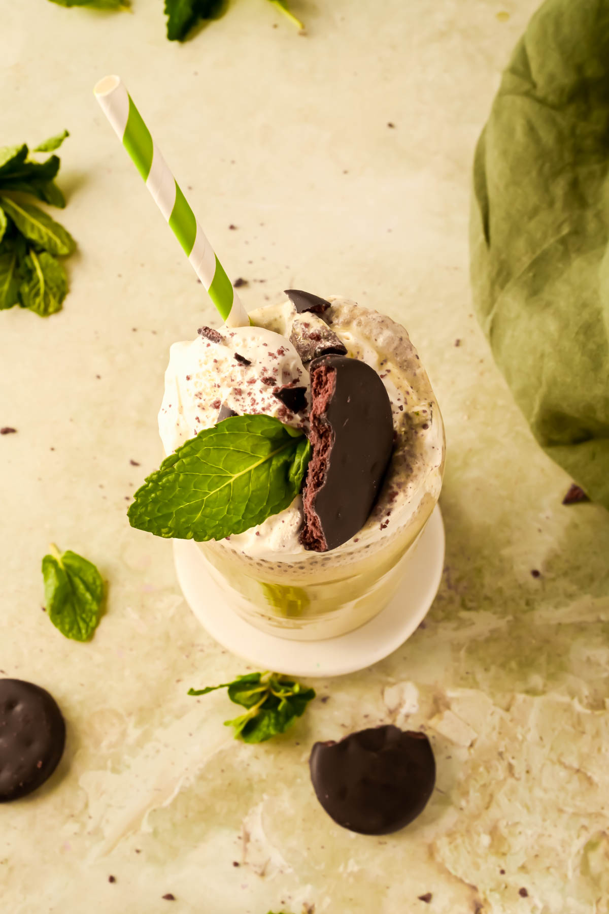 chocolate mint smoothie garnished with a thin mint cookie and mint leave.