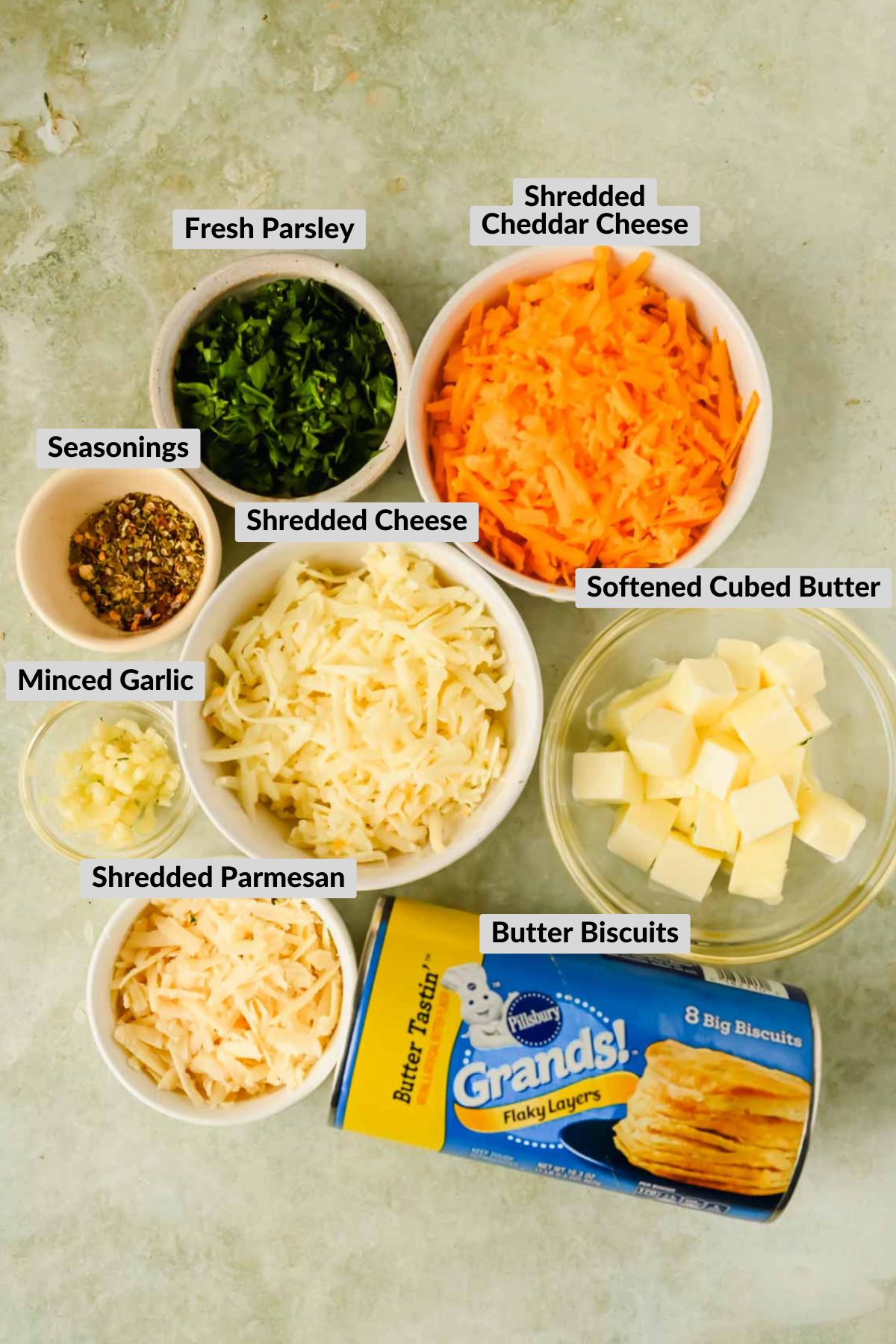 ingredients for cheesy monkey bread in individual bowls.
