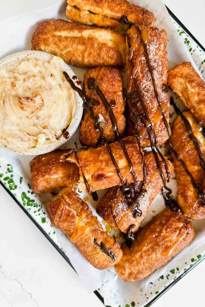 air fried cinnamon sticks drizzled with chocolate and caramel sauce.