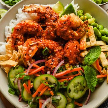 hot honey shrimp over rice and veggies in large serving bowl.