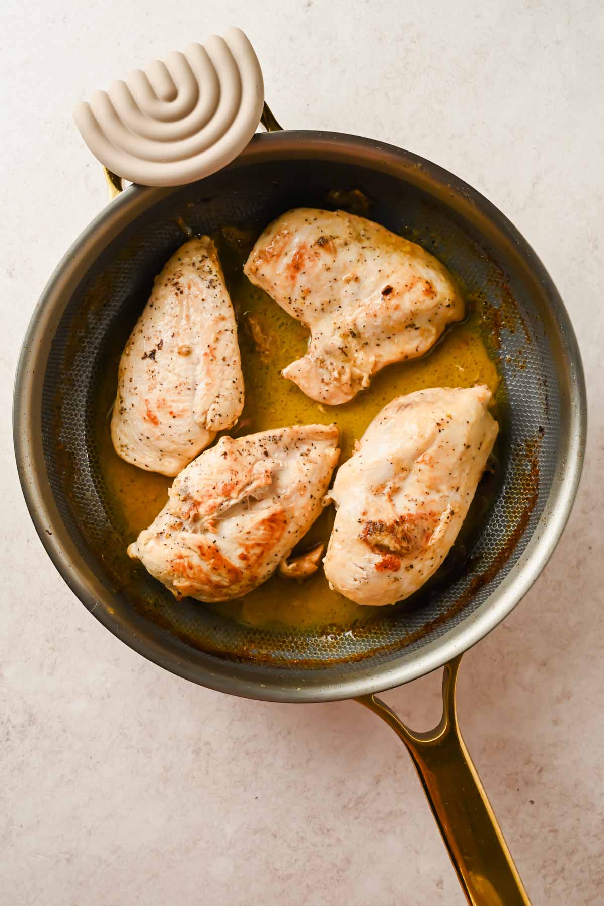 4 chicken breasts seasoned and cooked in large skillet.