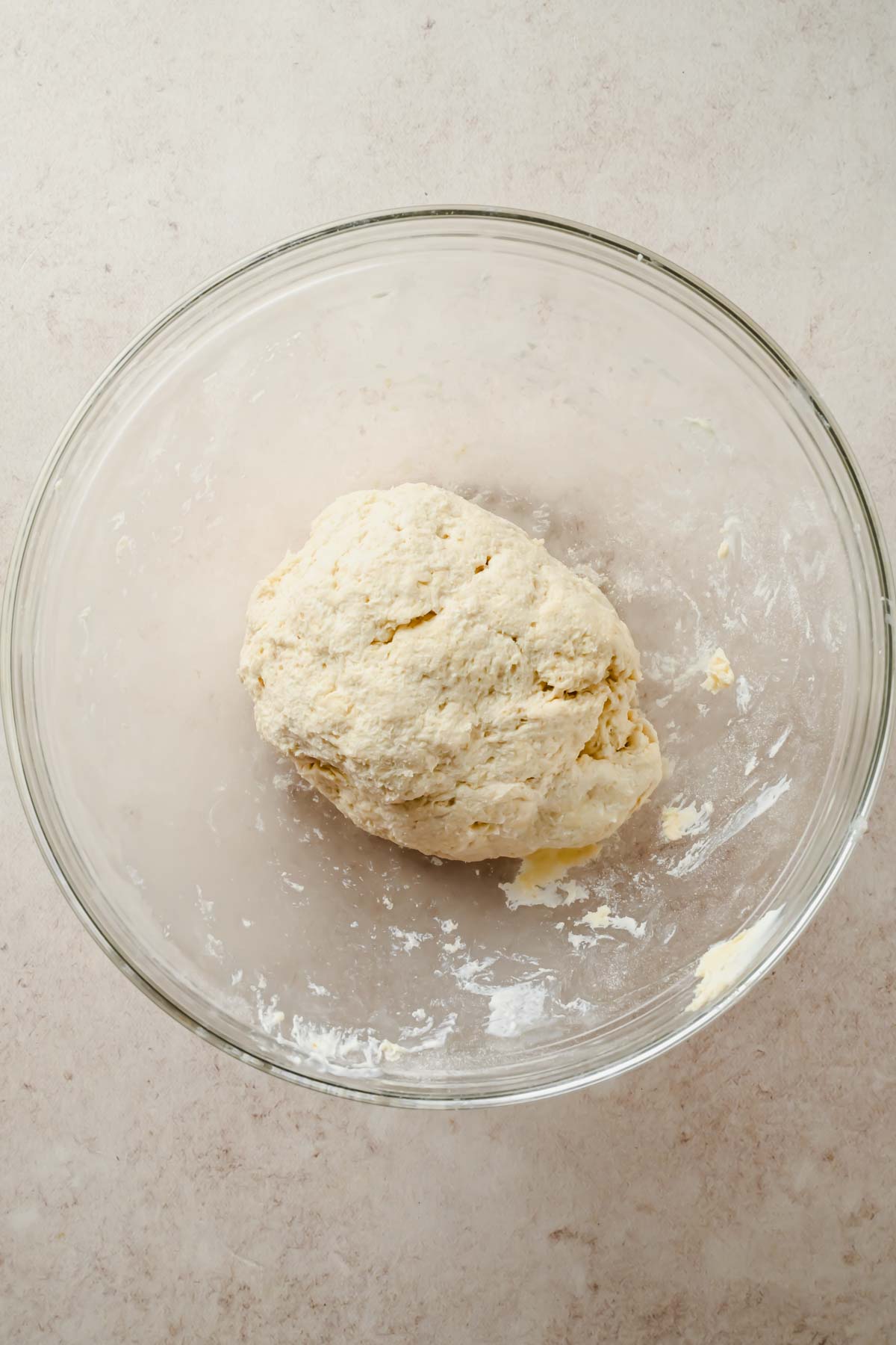 dourgh ball in large glass mixing bowl.