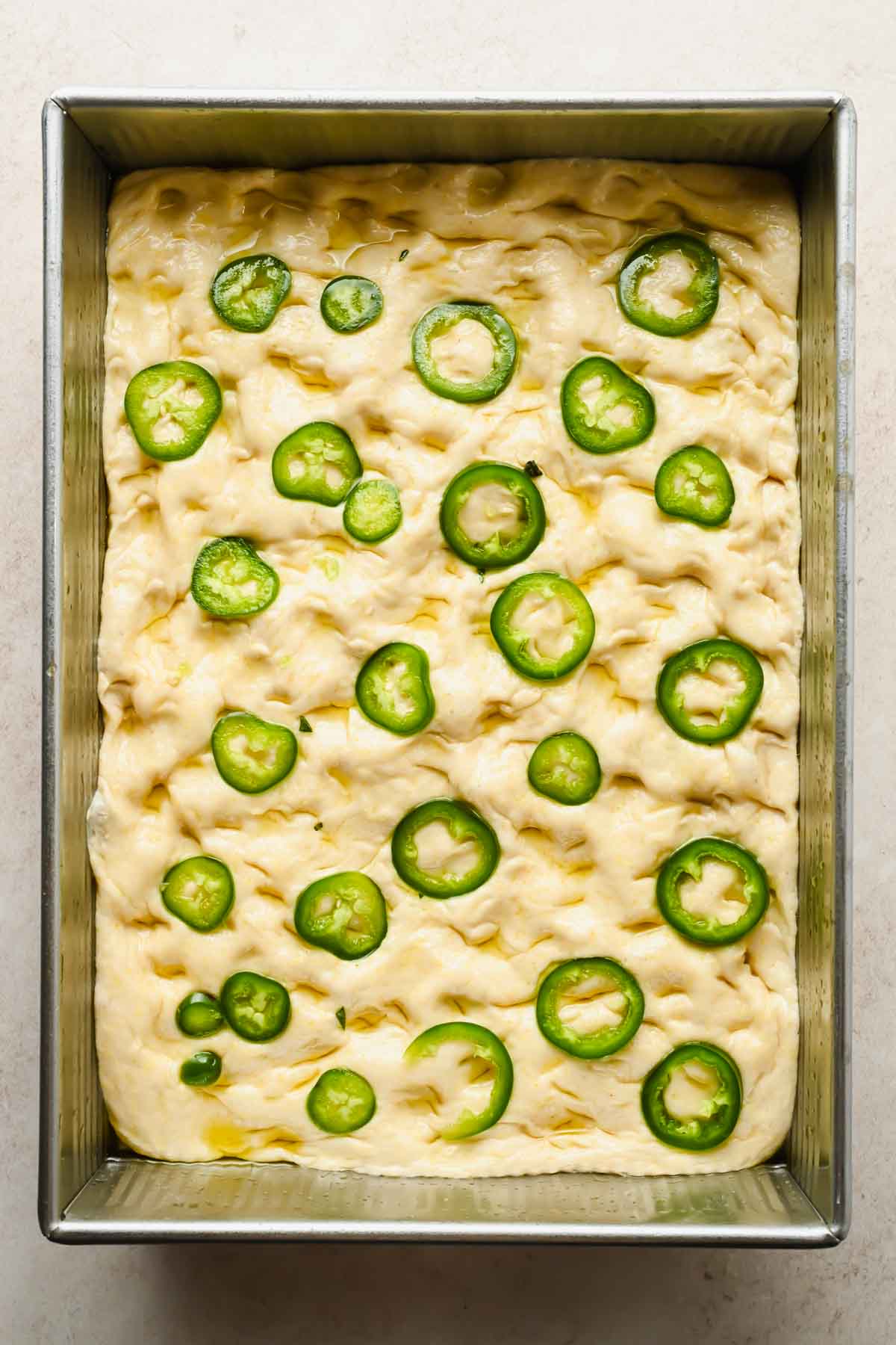 raw honey jalapeno cornbread dough in baking dish before baking.