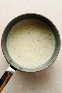 creamy mac and cheese muffin sauce in large sauce pot.