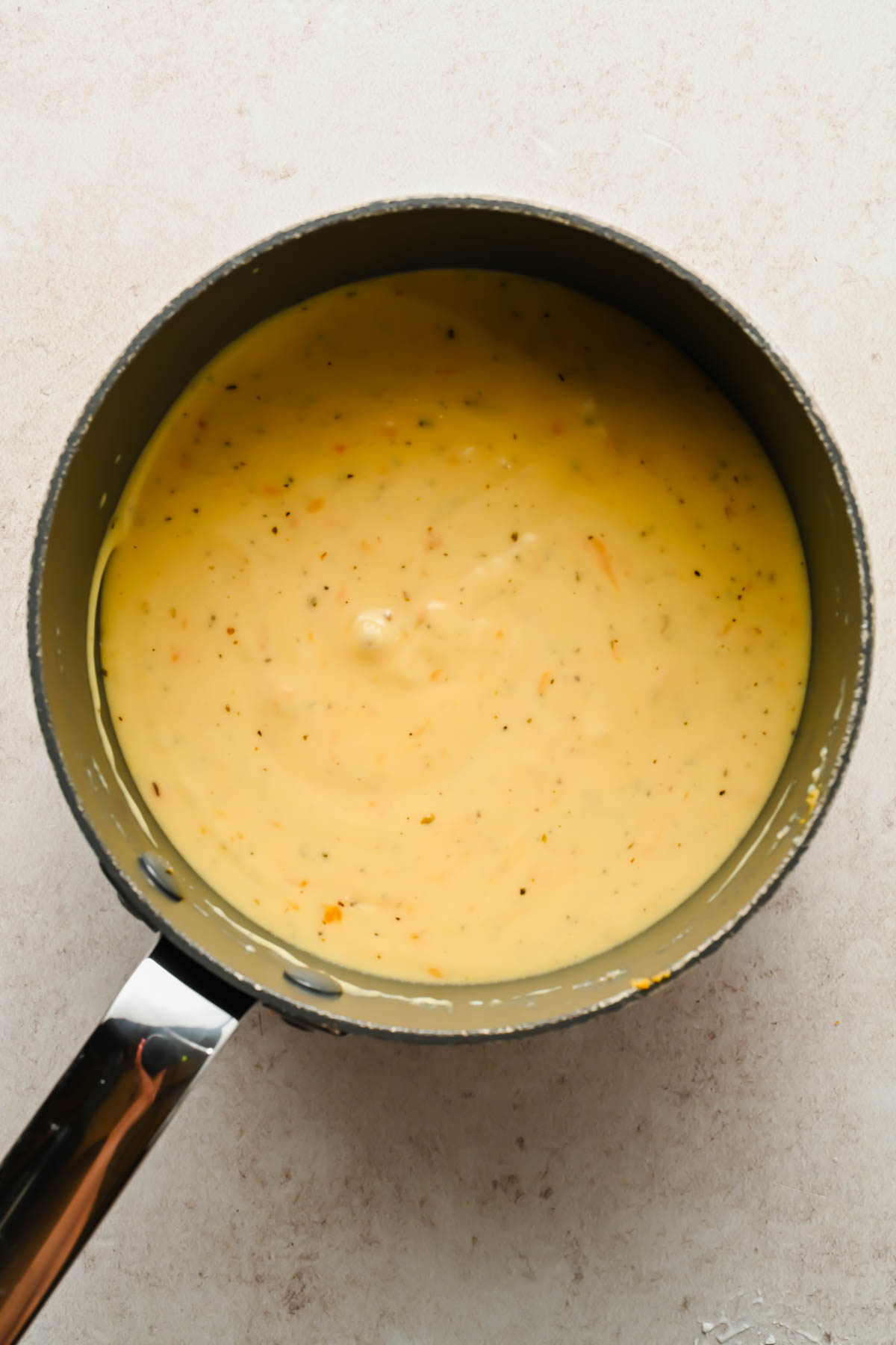 creamy mac and cheese muffin sauce in large sauce pot.