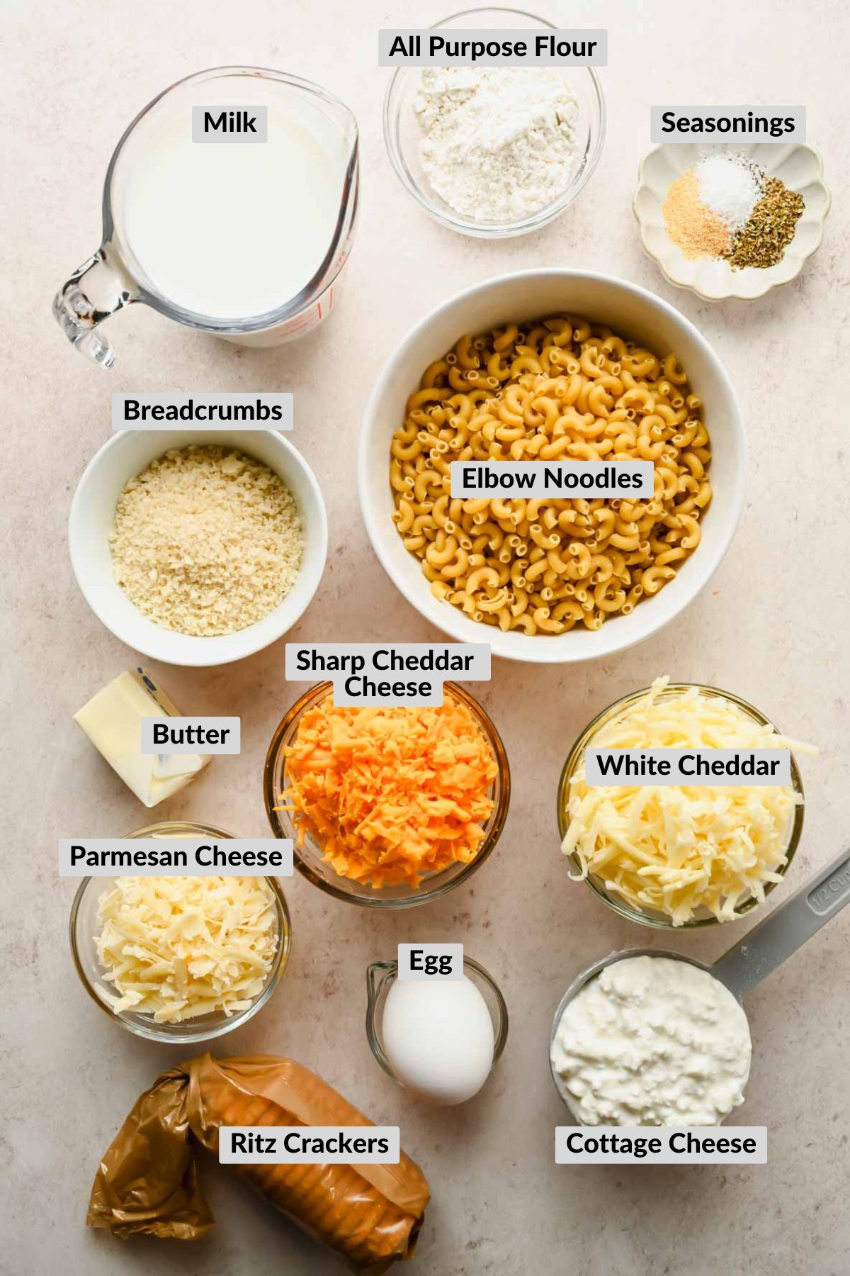 ingredients for mac and cheese muffins in individual bowls.