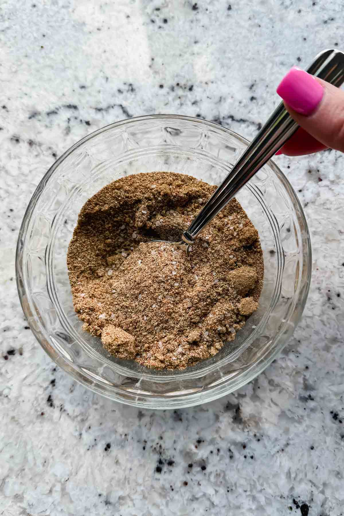 seasoning for turkey tenderloins in glass mixing bowl.