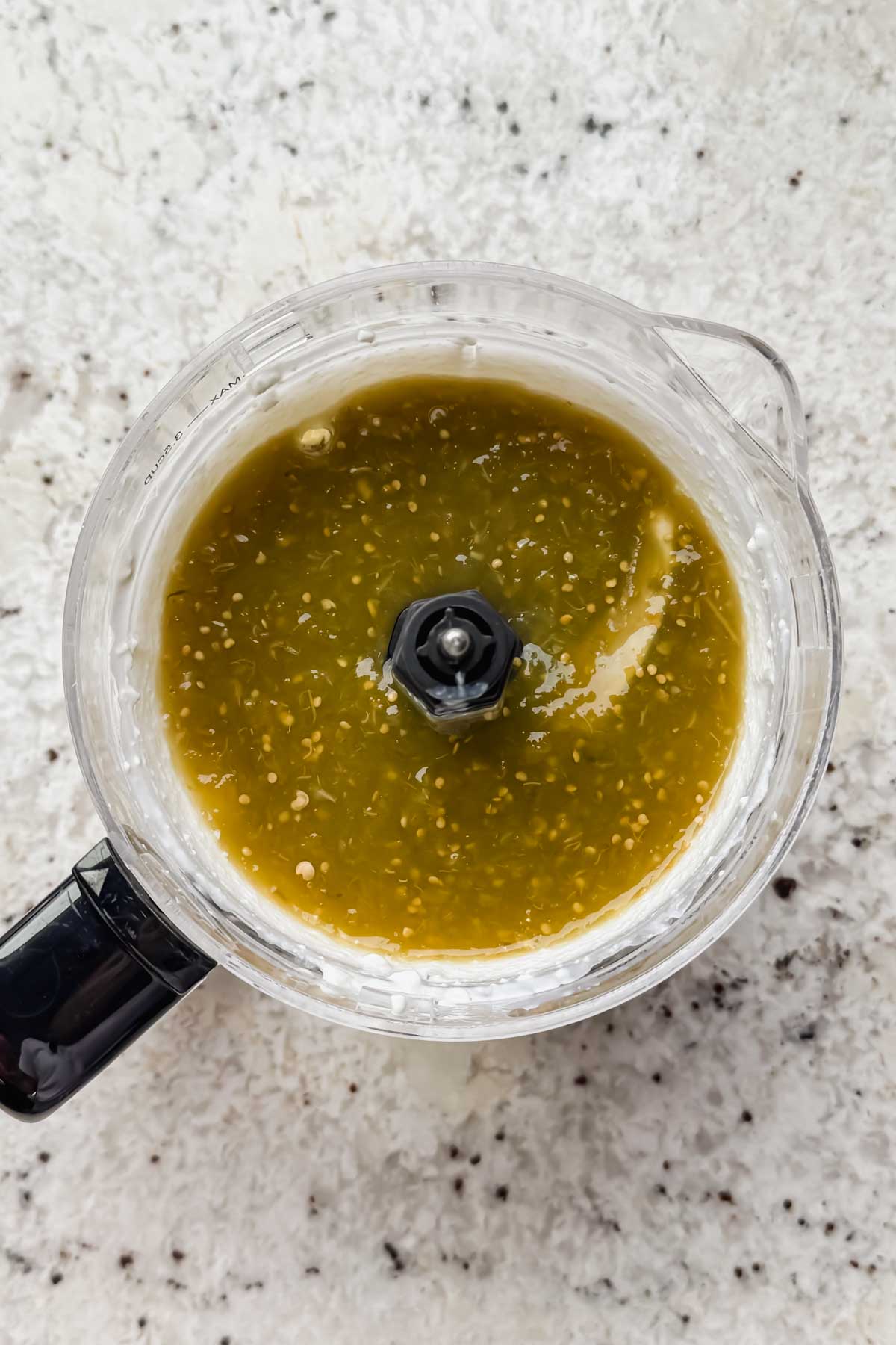 green enchilada sauce in food processor.