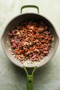 ground beef, onions and spices cooking in large skillet.