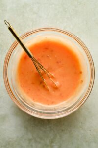 bang bang sauce mixed in glass bowl.