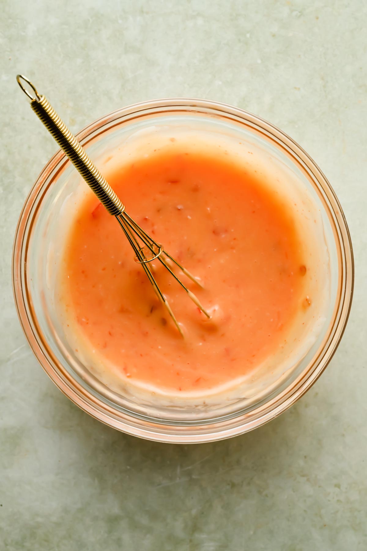 bang bang sauce mixed in glass bowl.