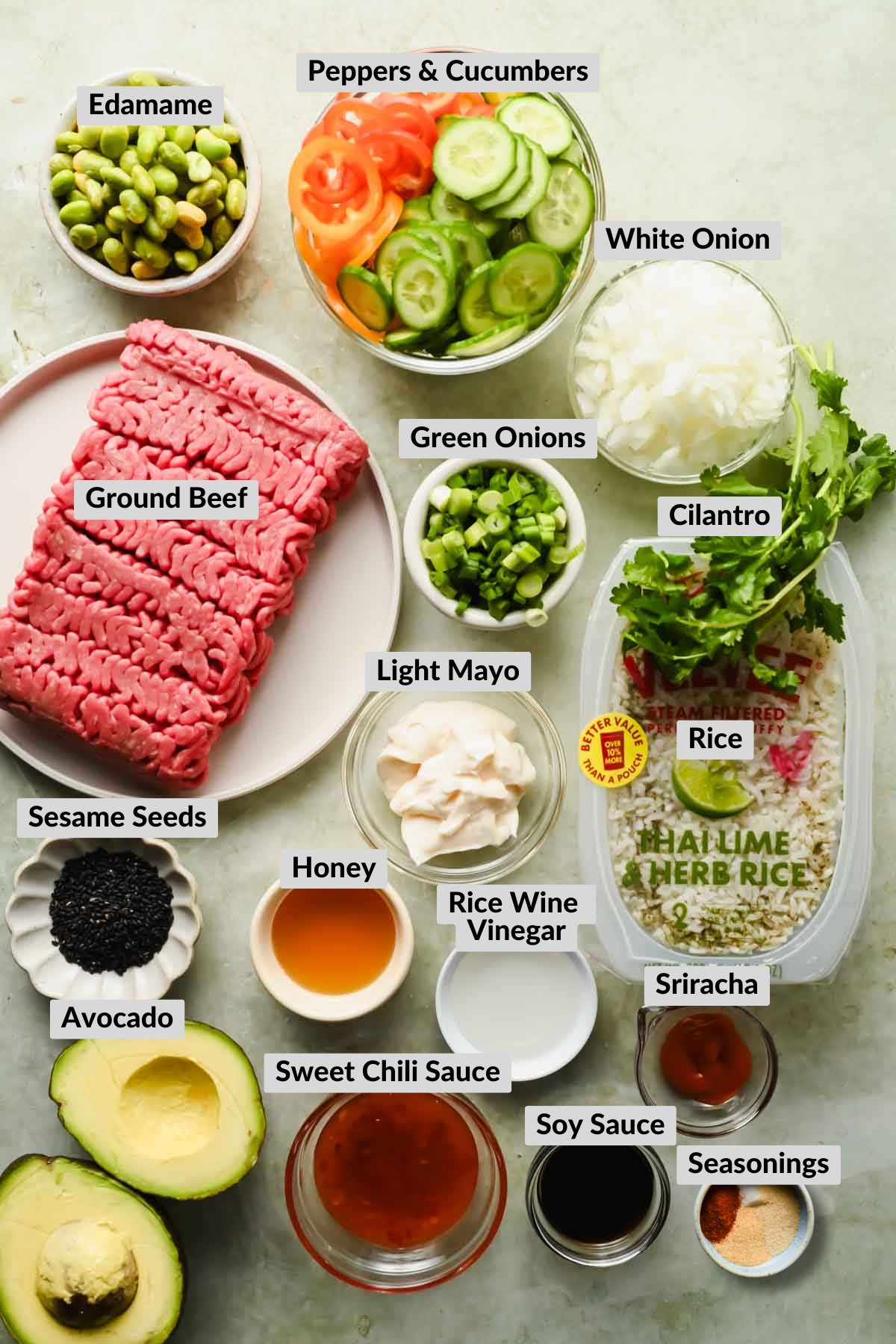 labeled ingredients for bang bang bowls in individual bowls.