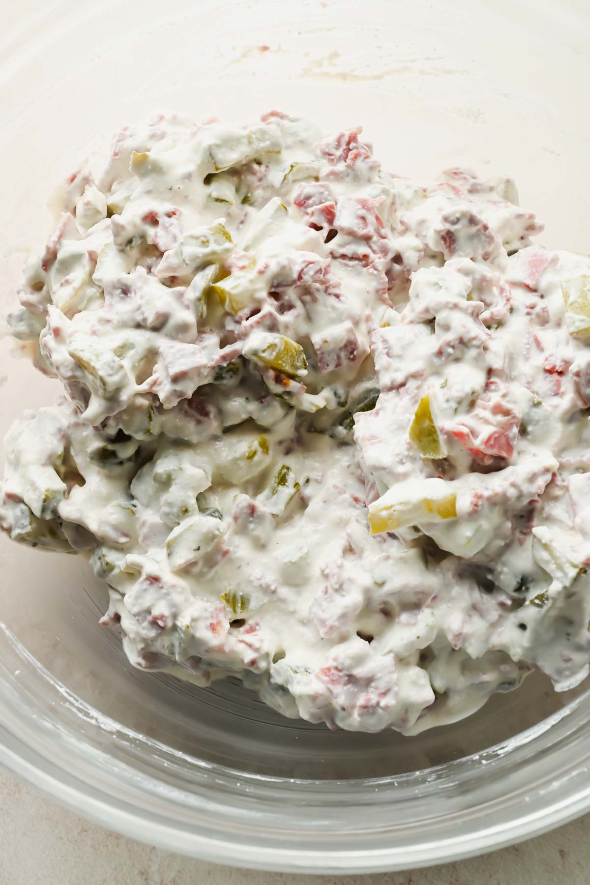 mixed corn beef dip in large glass mixing bowl