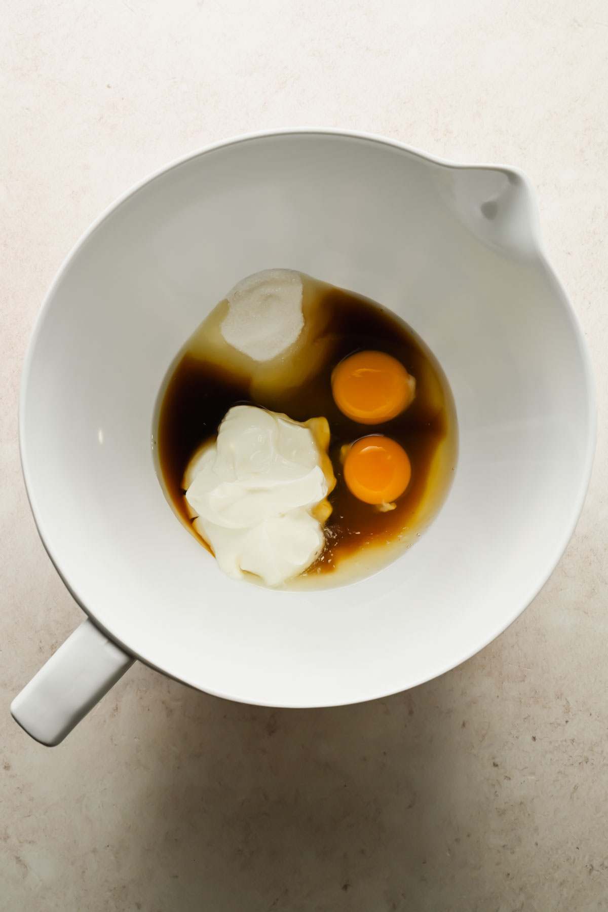 greek yogurt, eggs, and vanilla in large mixing bowl.