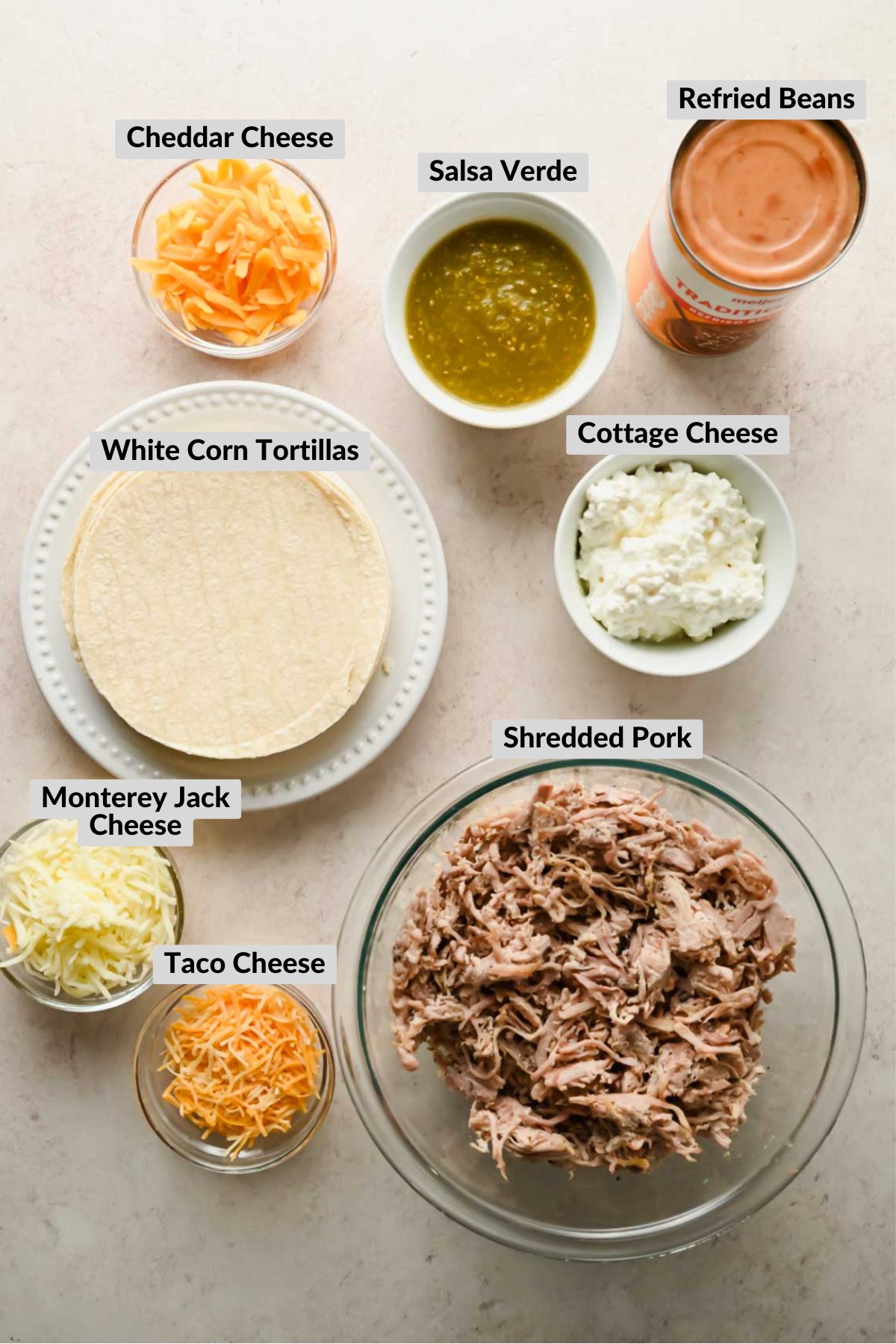 labeled ingredients for crispy baked pork tacos in individual bowls.