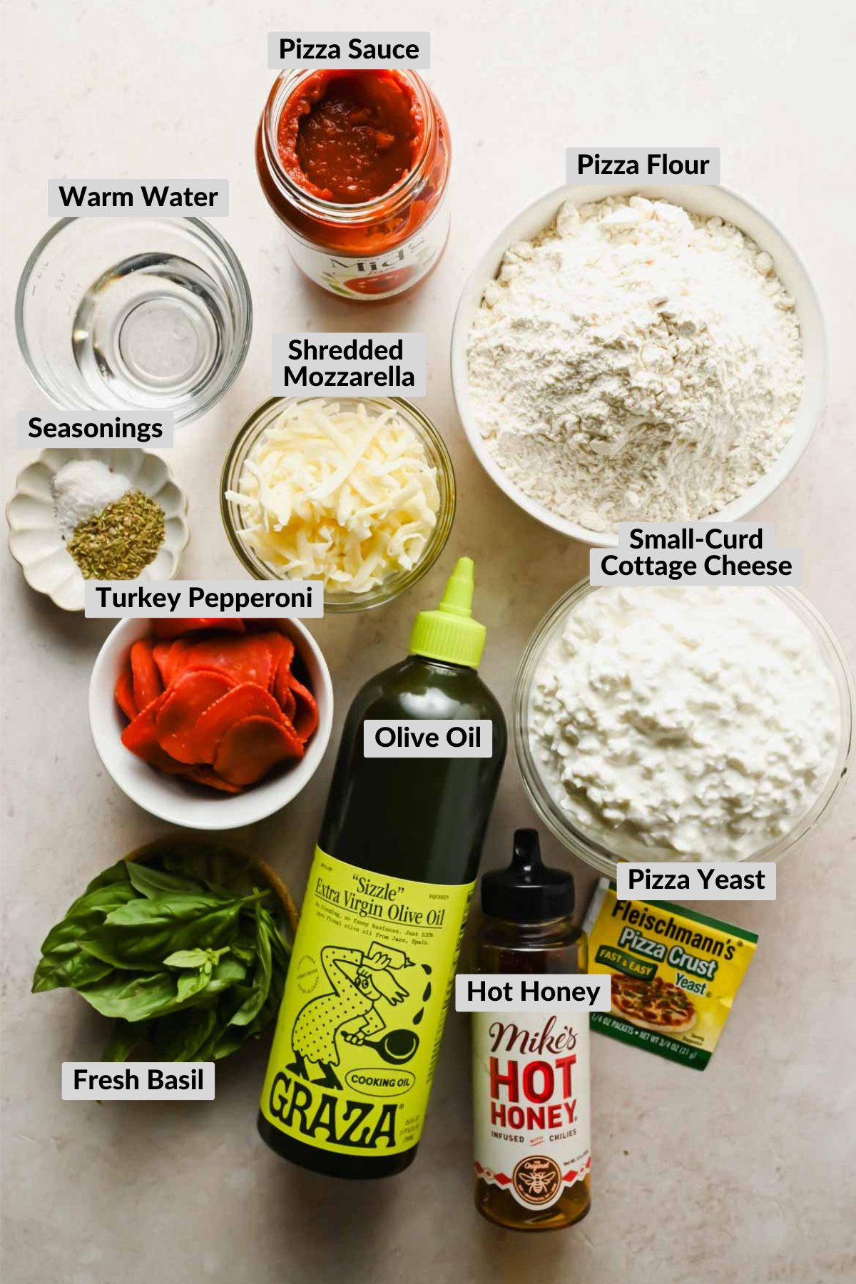 labeled ingredients for skillet pizza in individual bowls.