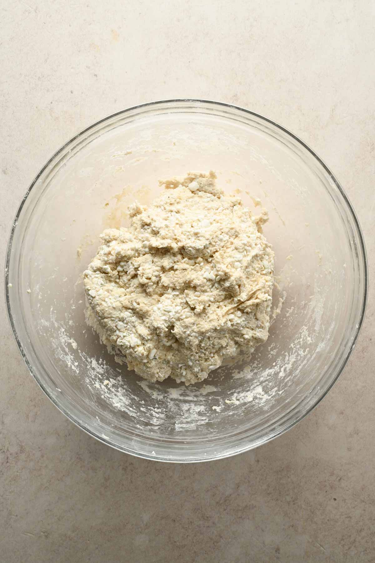 pizza crust ingredients in glass mixing bowl.