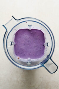 wild blueberry smoothie blended in large blender.