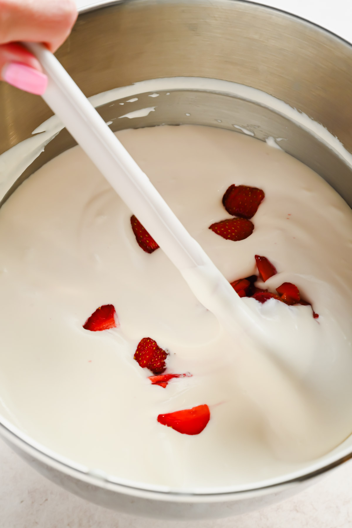 heavy whipping cream whipped with strawberries mixed in.