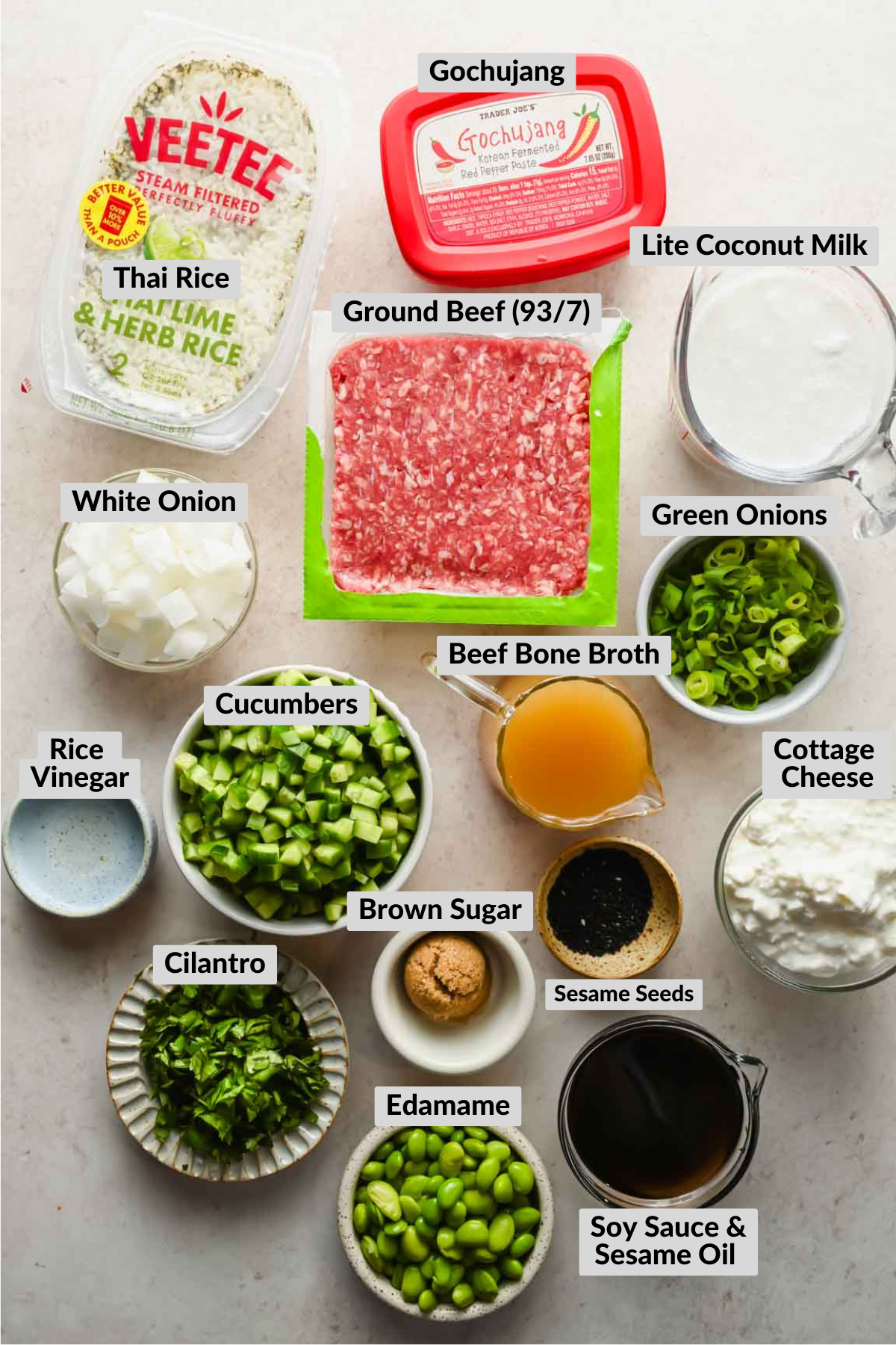 labeled ingredients for coconut rice bowl in individual bowls.