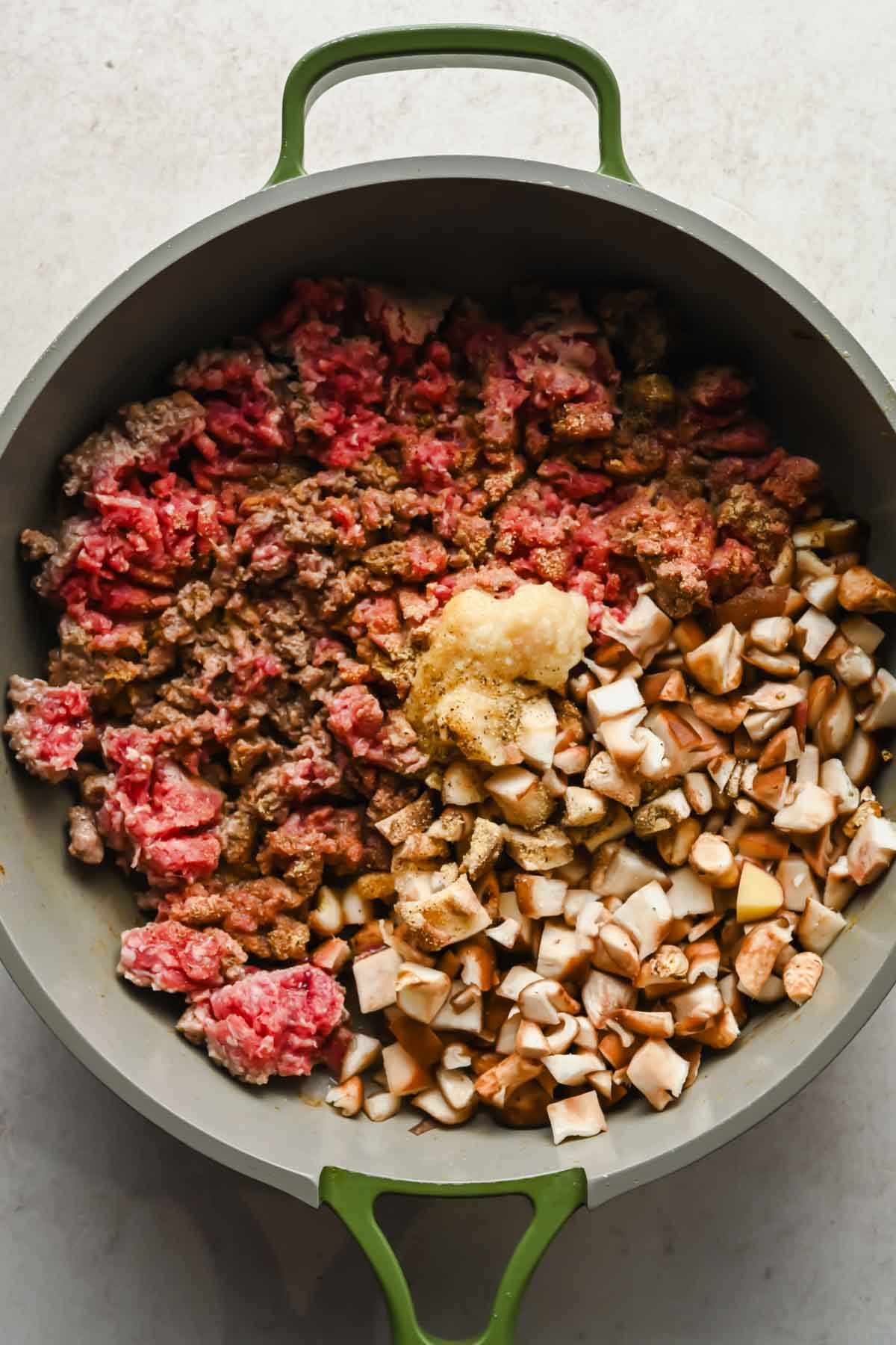 ground beef, seasonings and diced mushrooms cookin in large skillet.