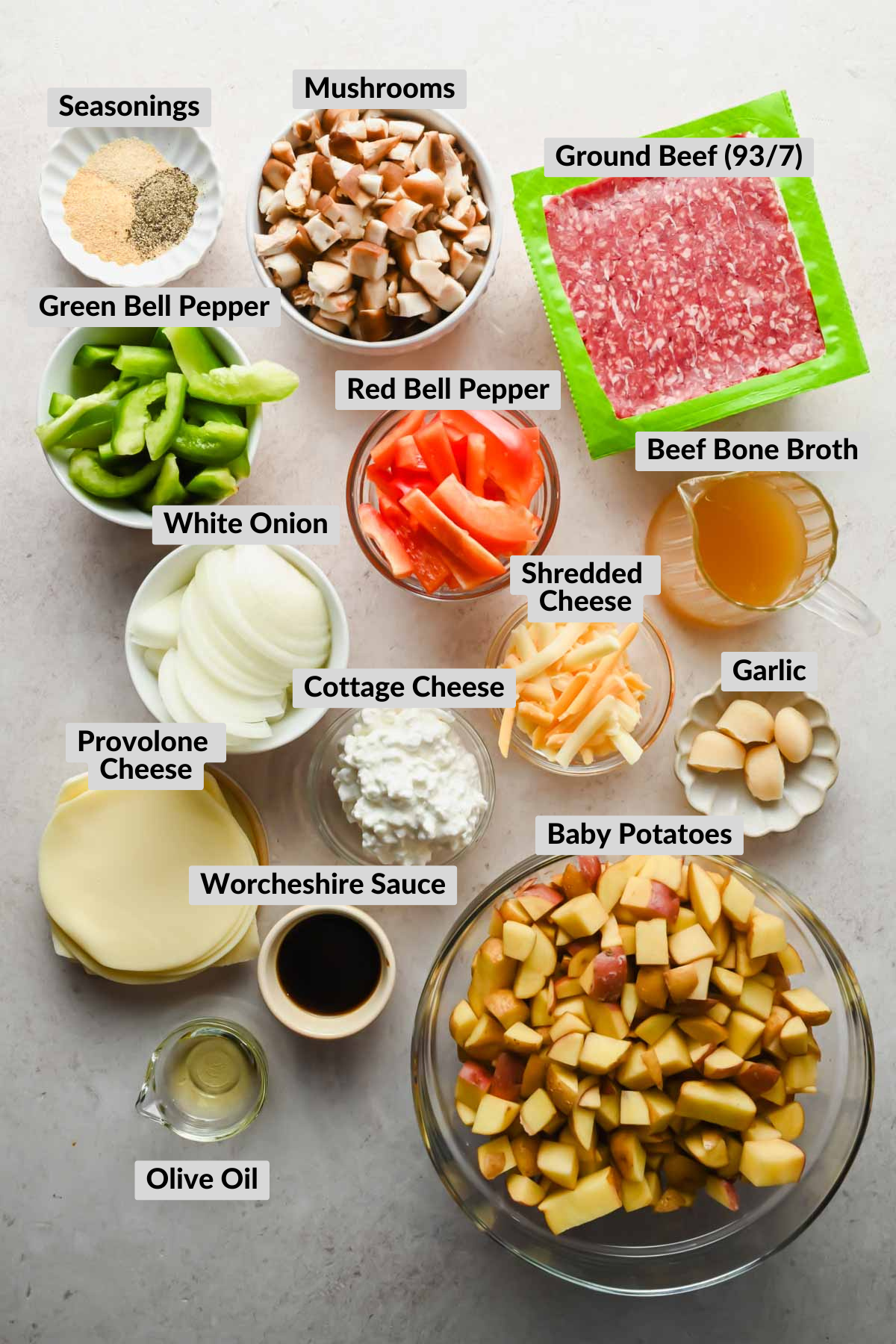 labeled ingredients for Philly cheesesteak bowl in individual bowls.