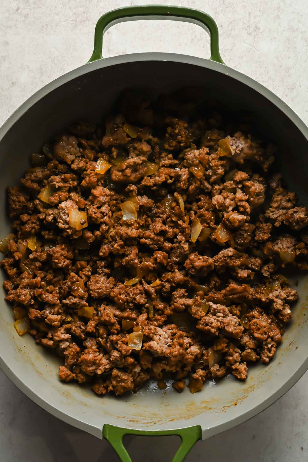 ground beef and onions cooked in large skilet.