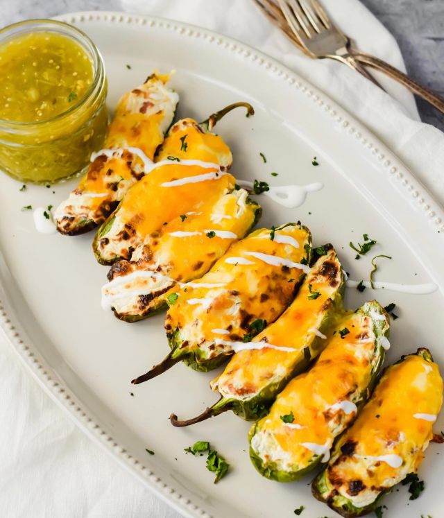 Cheesy Jalapeno Poppers are a sure fire way to bring some heat to the dinner table 🔥🌶These spicy, crunchy peppers are stuffed with an incredibly creamy filling seasoned with garlic and paprika and topped with bubbly, gooey melted cheese…they’re a great appetizer and snack - tap the link in my bio for the full recipe: 
.
https://apaigeofpositivity.com/cheesy-jalapeno-poppers/